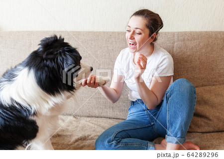 Stay Home Stay Safe. Smiling young attractive Stay Home Stay Safe. Smiling young attractive 64289296