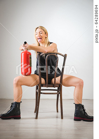 Beautiful blonde girl, dressed in a blue dress 64289694