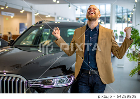 happy owner of new car 64289808