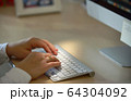 Close-up of woman hands using computer keyboard 64304092