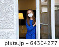 Young girl in quarantine looking-out depressed 64304277
