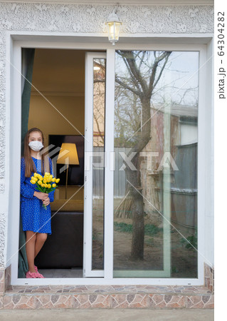 Girl depressed looking out 64304282