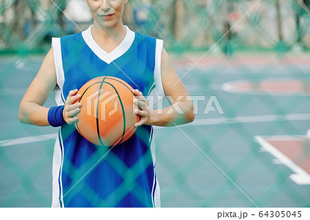 Woman with basketball ball Woman with basketball ball 64305045