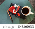 strawberry cake on a black plate and coffee 64306933
