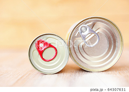 Canned food in metal cans on wooden background 64307631