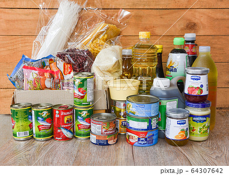 Donations box with canned food on wooden table Donations box with canned food on wooden table 64307642