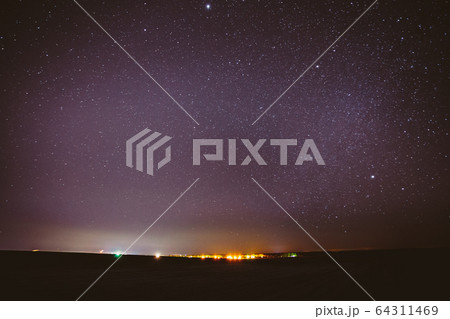 Real Night Sky Stars Background With Natural Colourful Sky Gradient. Sunset, Sunrise Light And Starry Sky Over Horizon 64311469