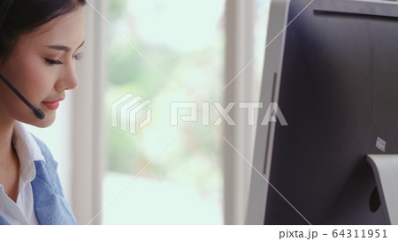 Customer support agent or call center with headset 64311951