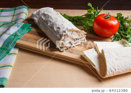 Pita bread or lavash wrapped with cottage cheese 64312380
