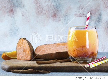 Sweet Potato Smoothie coctail with Cinnamon. Gluten-free, healthy food concept Sweet Potato Smoothie coctail with Cinnamon. Gluten-free, healthy food concept 64312723