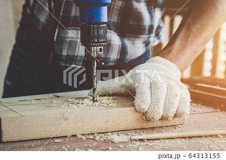 Carpenter working on wood craft at workshop Carpenter working on wood craft at workshop 64313155
