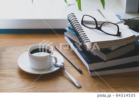 Workplace of a man a desk book in home interior. The concept of distance learning or online learning. 64314535