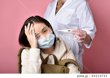 Asian woman backpacker get sick and high fever temperature Asian woman backpacker get sick and high fever temperature 64314733
