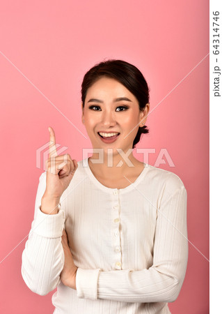 Beautiful asian woman hand finger point presenting product for mock-up advertising. Beautiful asian woman hand finger point presenting product for mock-up advertising. 64314746