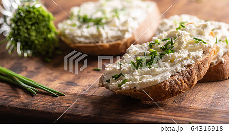 Close up of a thick spread of sheep cheese on 64316918