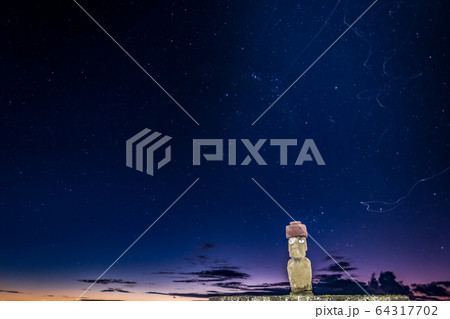 Ahu Ko Te Riku moai with eyes in Rapa Nui at night with bug trails 64317702