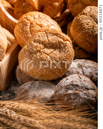 A variety of bread put together in a pile 64318871