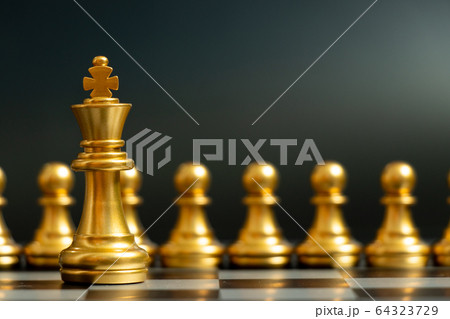 Gold king chess piece stand in front of pawn on black background (Concept of leadership, management) 64323729