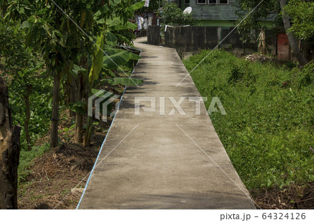 Long concrete walkway 64324126
