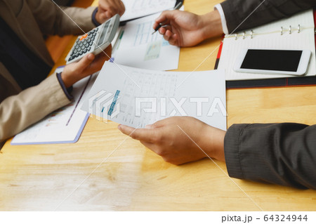 Business team meeting and discussing project plan. 64324944