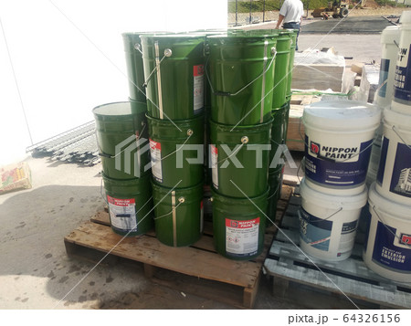 Paint buckets stacked at the construction site. Ready to used by the painter for internal and external painting work. Paint buckets stacked at the construction site. Ready to used by the painter for internal and external painting work. 64326156