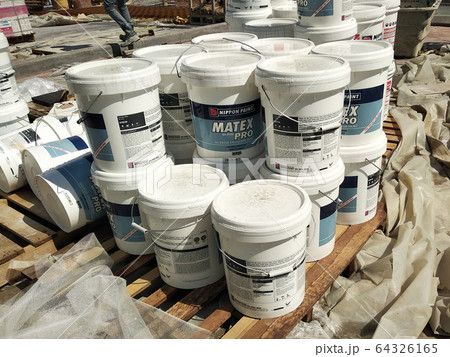 Paint buckets stacked at the construction site. Ready to used by the painter for internal and external painting work.   64326165