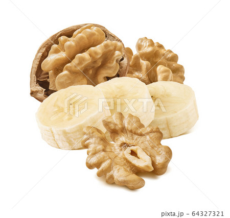 Walnut nuts and banana isolated on white Walnut nuts and banana isolated on white 64327321