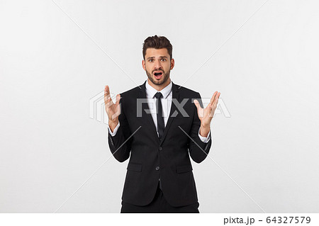 Shocked surprised businessman looking at camera with big eyes. isolated on white, looking at camera Shocked surprised businessman looking at camera with big eyes. isolated on white, looking at camera 64327579