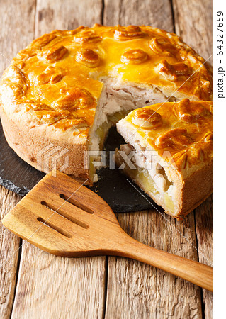 Kurnik sliced pie with chicken, potatoes and 64327659