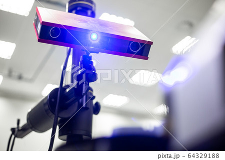 Professional 3D scanner scanning an industrial object plastic molding placed on a turntable, metrology concept 64329188