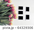 Red and yellow tulips with number eight. Top view of the white background of the spring composition. 64329306