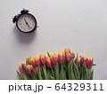 Red and yellow tulips with number eight. Top view of the white background of the spring composition. 64329311
