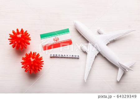 Flight ban and closed borders for tourists and travelers with coronavirus covid-19. Airplane and flag of Iran on a white background. Coronavirus pandemic. Flight ban and closed borders for tourists and travelers with coronavirus covid-19. Airplane and flag of Iran on a white background. Coronavirus pandemic. 64329349