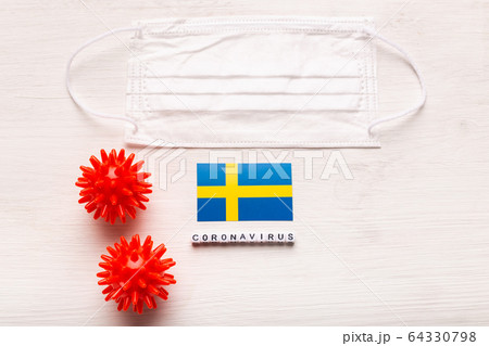 Coronavirus 2019-nCoV concept. Top view protective breathing mask and flag of Sweden. Novel Chinese Coronavirus outbreak. 64330798