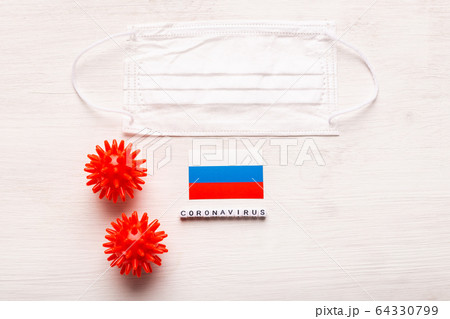 Coronavirus 2019-nCoV concept. Top view protective breathing mask and flag of Russia. Novel Chinese Coronavirus outbreak. 64330799