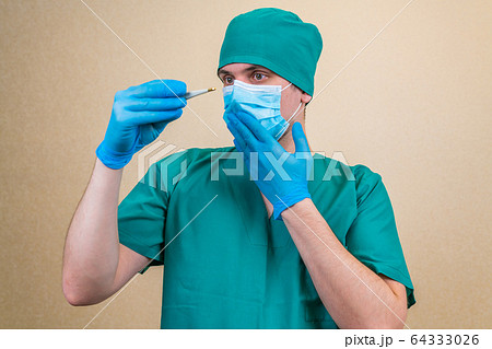 Doctor with white thermometer in hand 64333026