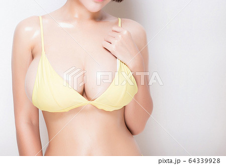 Close up of female big natural breasts. Isolated 64339928