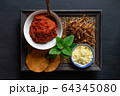 ingredient of thai spicy soup in ceramic bowl. 64345080