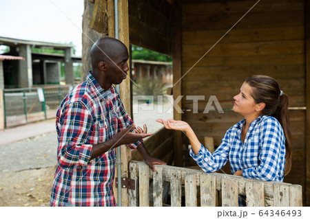 Woman having unpleasant talk with neighbour Woman having unpleasant talk with neighbour 64346493