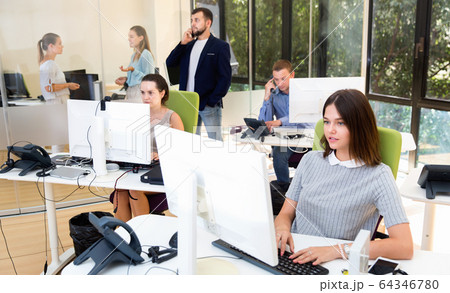 Group of successful business people during daily work in modern co-working space 64346780