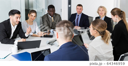 business partners discuss ideas for teamwork business partners discuss ideas for teamwork 64346959