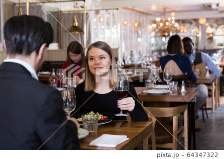 Lovely couple is dining together 64347322