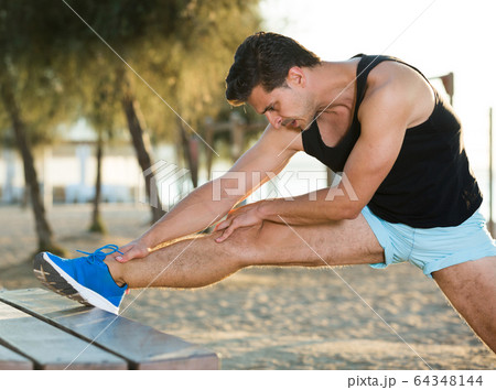 Man doing stretching workout 64348144