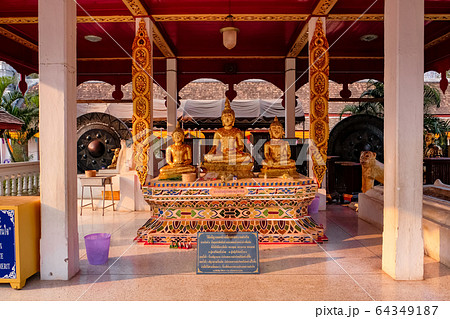 Thailand,Nan - Febury 28, 2020: Golden Three Buddhas for wishes at Wat Phra That Chae Haeng Thailand,Nan - Febury 28, 2020: Golden Three Buddhas for wishes at Wat Phra That Chae Haeng 64349187