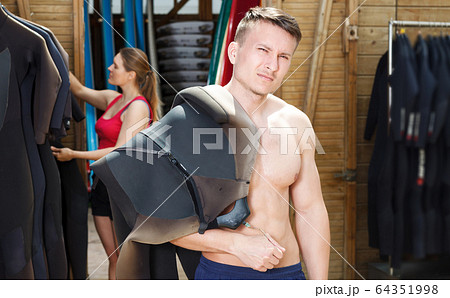 man looking for water suit 64351998