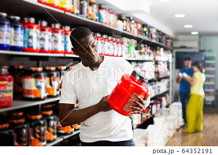 Athletic African looking for necessary food supplements 64352191