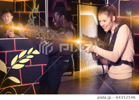 Two adult laser tag players during lasertag game 64352546