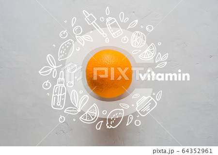 Orange and letter C on a yellow background. Doodle style icons image Flat lay Concept of protecting immunity during viral infection Orange and letter C on a yellow background. Doodle style icons image Flat lay Concept of protecting immunity during viral infection 64352961