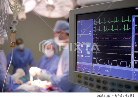 IV drip and heart monitor in hospital operating theatre IV drip and heart monitor in hospital operating theatre 64354591