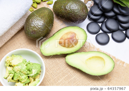 Avocado split in half for skin care and treatment Avocado split in half for skin care and treatment 64357967
